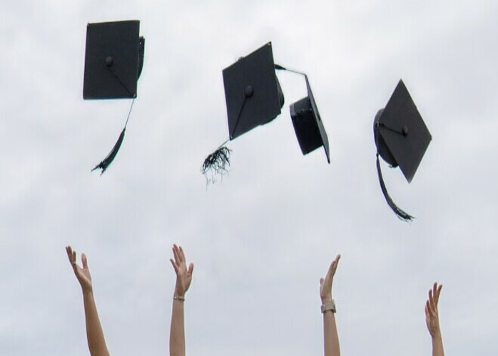 graduation caps being thrown in the air to symbolize the excitement and celebration of having learned something valuable.