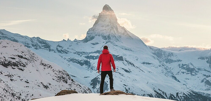 a man climbing a mountain