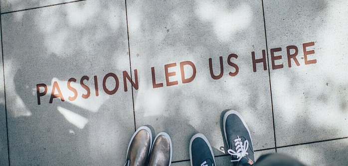 Passion Led Us Here written on the sidewalk - a reminder why a driving force is so important.