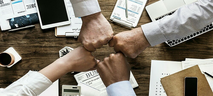 a group of people collaborating for mutual success