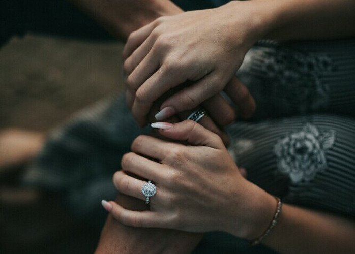 hands intertwined to show meaningful connection