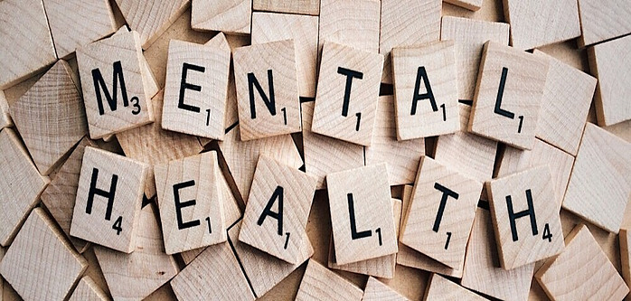 scrabble letters spelling out mental health