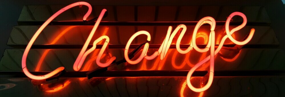 a glowing sign that says change