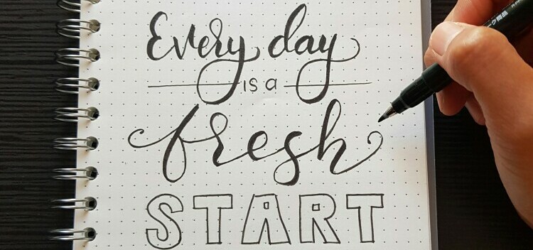 every day is a fresh start written on paper to show the potential for self improvement
