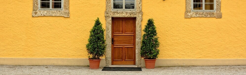 a front door on a yellow building