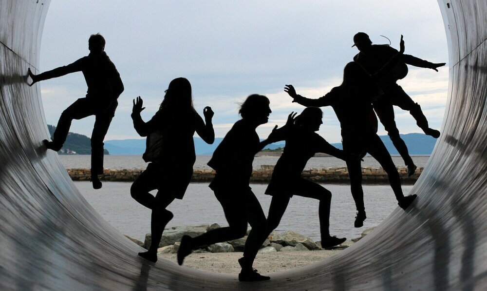 a group of happy entrepreneurs playing in a thriving community environment