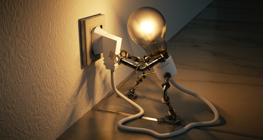 a lightbulb plugging itself in to show how we make our own motivation