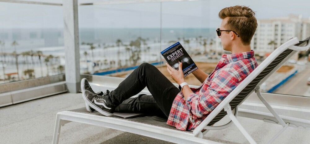 a man manifesting his dreams on a balcony