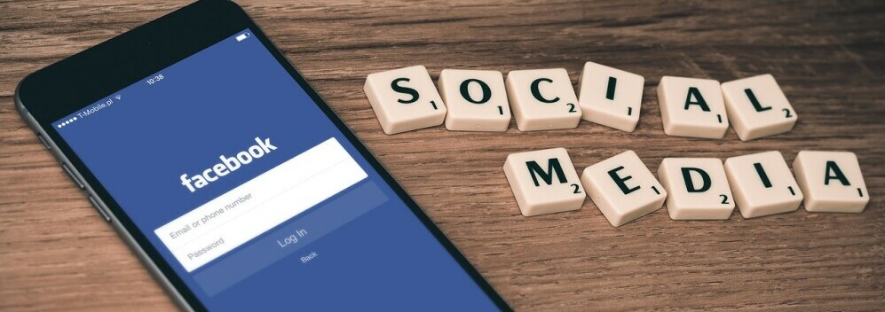 a phone with facebook open and 