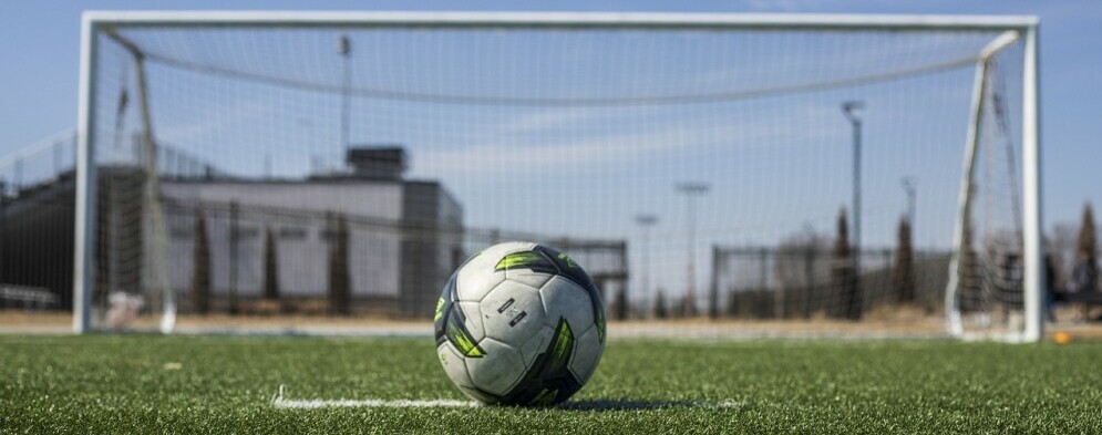a soccer goalpost and ball to signify the importance of having a clear goal