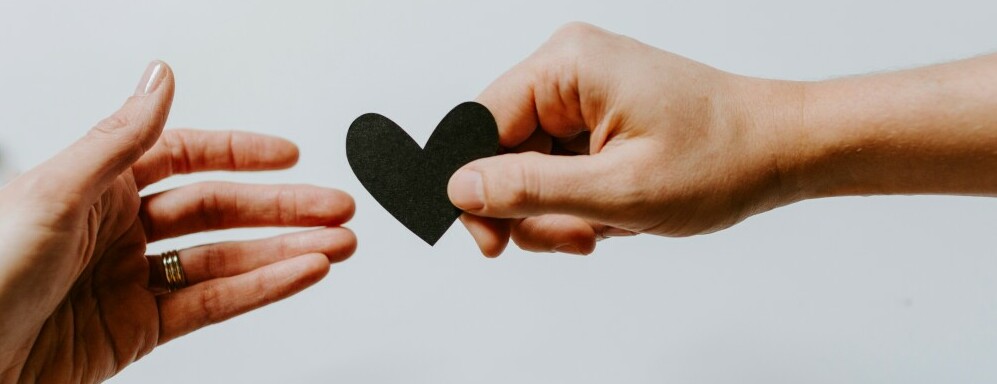 two hands holding a heart